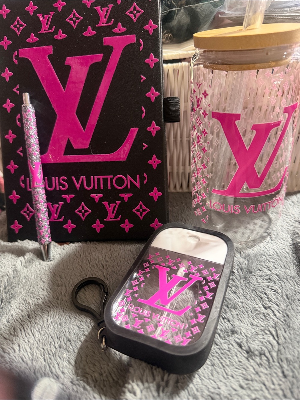 Pink & black journal with matching pen, glass tumbler & sanitizer spray bottle.